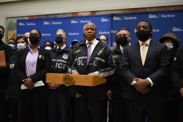 Mayor Eric Adams, with Police Commissioner Keechant Sewell to his right and Lieutenant Governor Brian Benjamin on his left, at Harlem Hospital on January 21, 2022